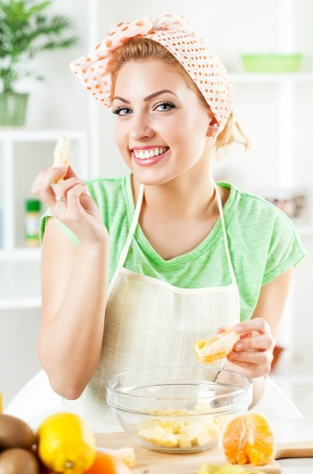 Photo of Amelia, founder of Savory Craving, smiling and standing in a kitchen setting