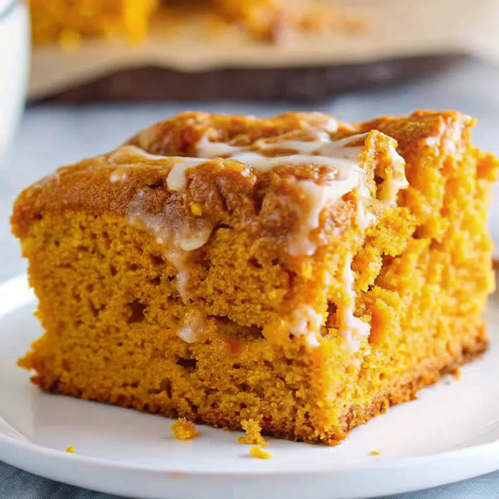 All Recipes 22 Golden pumpkin earthquake cake with swirled cream cheese, chocolate chips, and pecans showing characteristic cracked surface pattern in a white baking dish