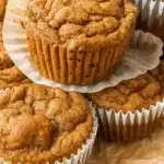 Healthy Pumpkin Banana Muffins 8 Golden brown pumpkin banana muffins with chocolate chips and cinnamon streusel topping arranged on a wire cooling rack