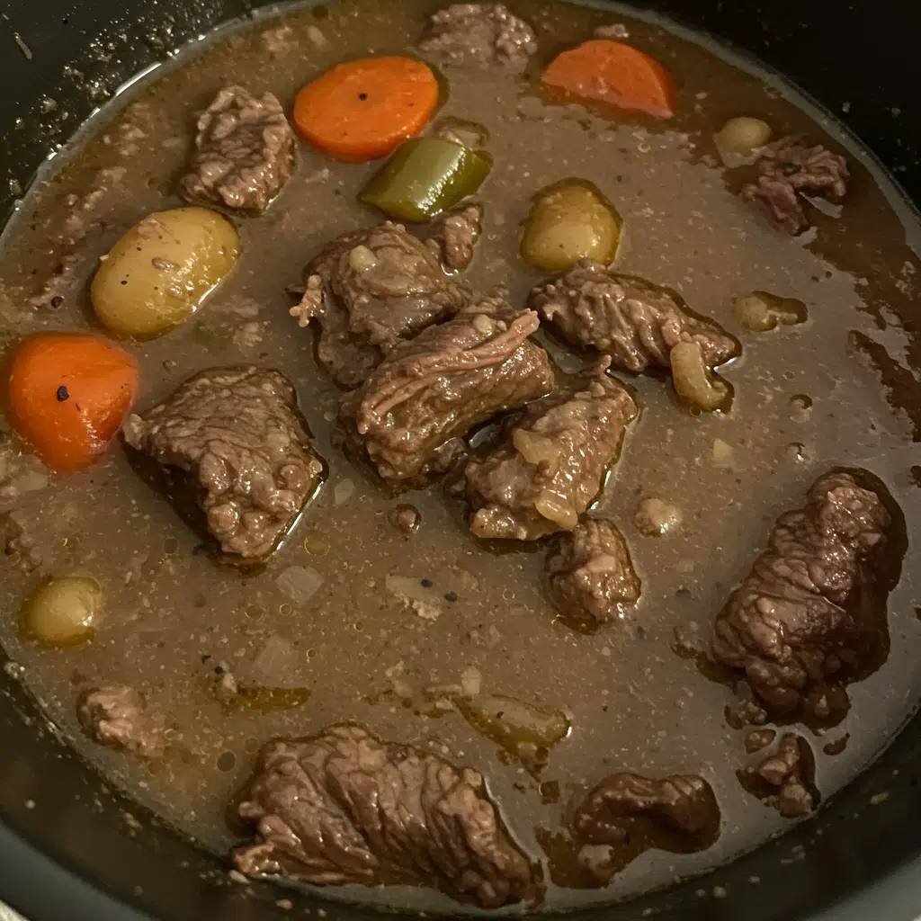 Crock Pot Beef Stew 4 A hearty bowl of Crock Pot Beef Stew with tender chunks of meat, colorful vegetables, and rich brown gravy, served with crusty bread