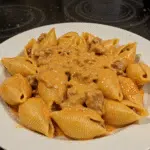Creamy Paprika Steak Shells 8 paprika steak shells in creamy orange sauce, sprinkled with green parsley
