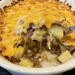 Crockpot Cheesesteak Potato Casserole 10 Crockpot Cheesesteak Potato Casserole topped with melted cheddar and fresh parsley