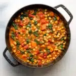 Easy Tuscan Chickpea Soup 8 A bowl of creamy Tuscan chickpea soup garnished with rosemary oil