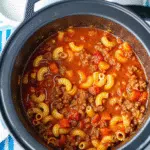 Crock Pot American Goulash 8 This Crock Pot American Goulash is loaded with tender ground beef, perfectly cooked pasta, and a rich tomato sauce that'll have your family asking for seconds.