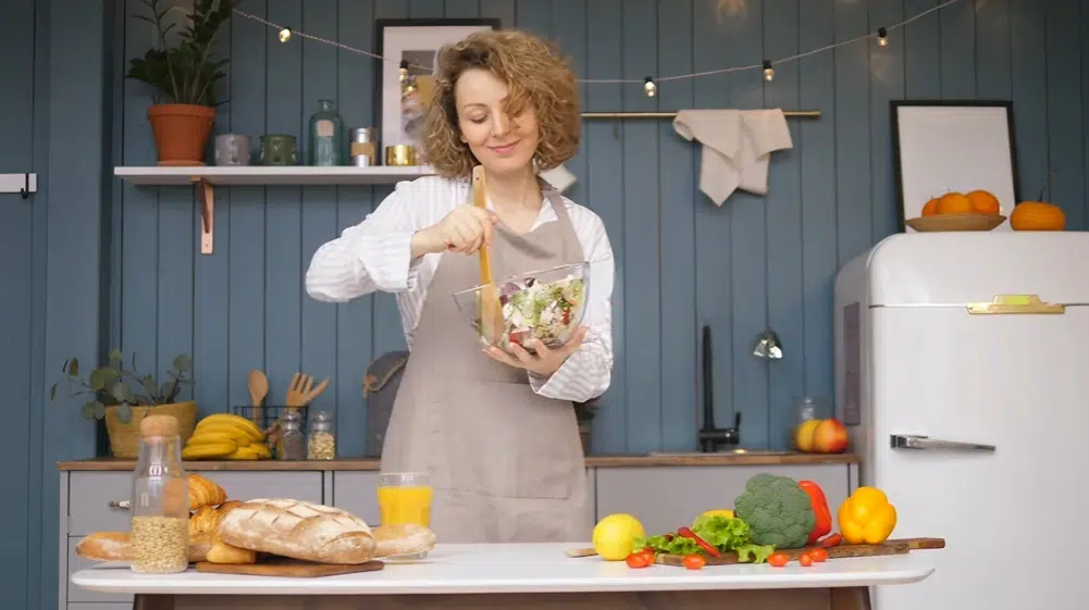 About me 2 inez preparing fresh salad in a cozy kitchen
