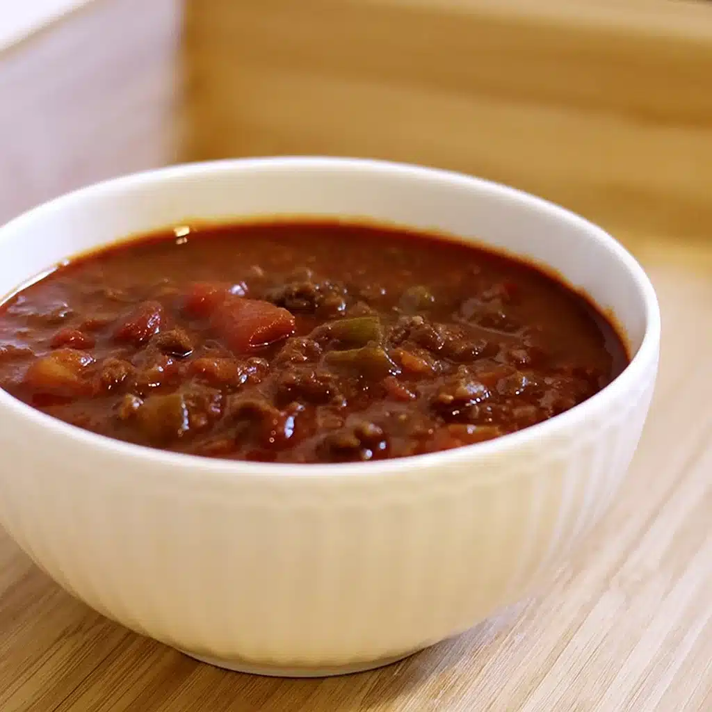 Home Page 21 A large pot of homemade Wendy's copycat chili with ground beef, beans, and vegetables in rich tomato sauce