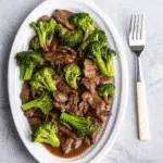 Chinese Beef and Broccoli with tender beef strips, crisp broccoli, and savory garlic-ginger sauce – ready in just 20 minutes!
