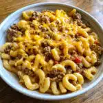 This Cheesy One Pot Beef is pure comfort food magic! Tender macaroni, savory ground beef, and melty cheddar cheese all cooked together in one pot for easy cleanup. Ready in just 30 minutes