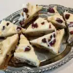 Homemade Cranberry Bliss Bars that taste even better than the coffee shop version! Soft, chewy, and packed with holiday flavor.