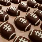 No-bake Football Oreo Truffles with just 3 ingredients! Crushed Oreos, cream cheese, and chocolate make the perfect game day dessert.