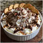 Turtle Cheesecake Dip tastes like your favorite turtle candies in dip form! Fluffy cream cheese loaded with chocolate chips and pecans, drizzled with caramel and chocolate