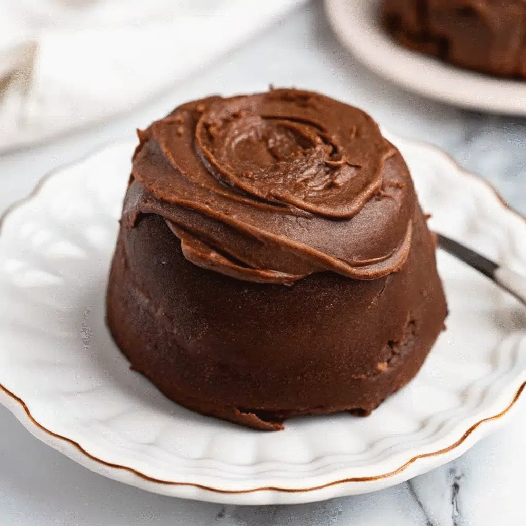 chocolate cinnamon rolls arranged in a baking dish, topped with glossy chocolate cream cheese glaze, with visible chocolate swirls throughout the soft dough