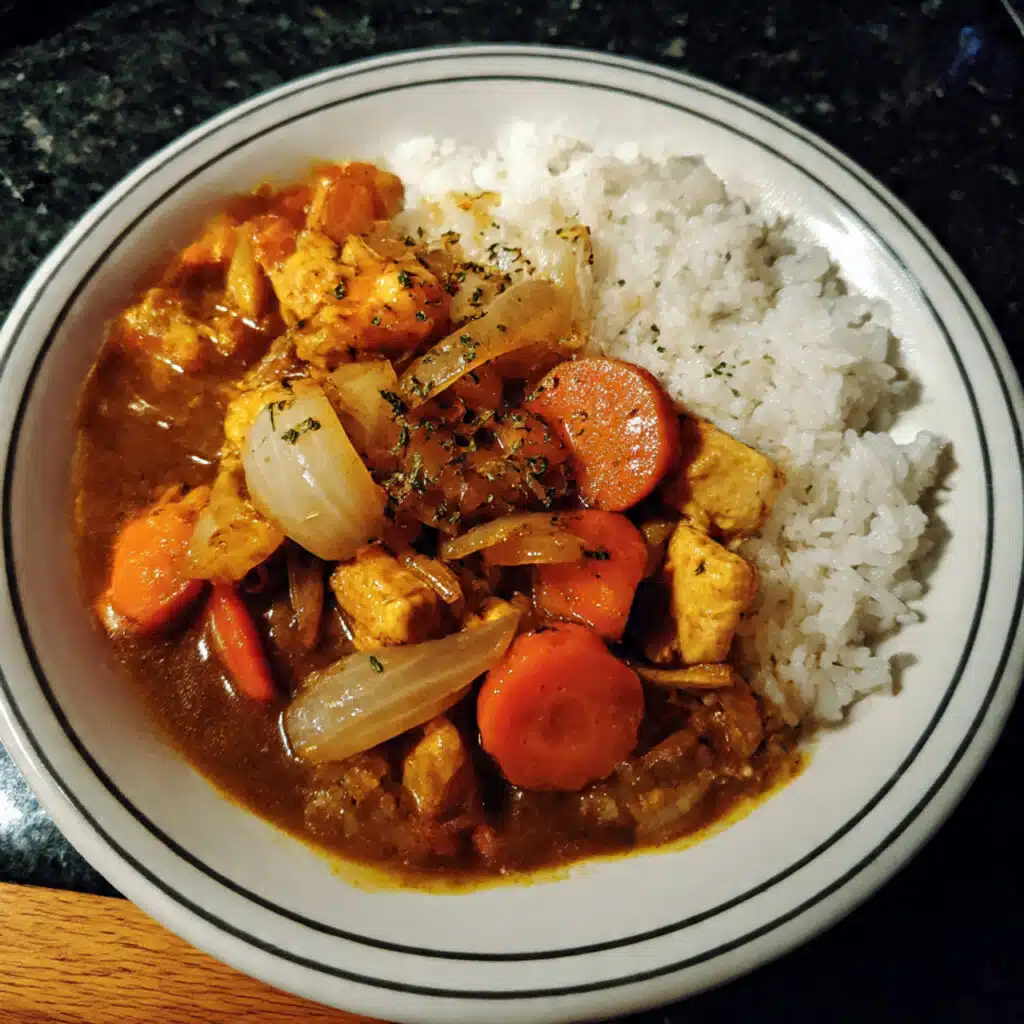 Homemade Japanese Curry with tender chicken thighs, sweet carrots, creamy potatoes, and that signature savory-sweet curry sauce served over steamed rice