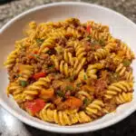 One Pot Beef Taco Pasta - all the bold flavors of taco night meet creamy, cheesy pasta in ONE easy skillet! Ready in 30 minutes.