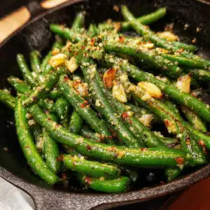 Fresh green beans sautéed in garlic butter and topped with a sprinkle of seasoning.