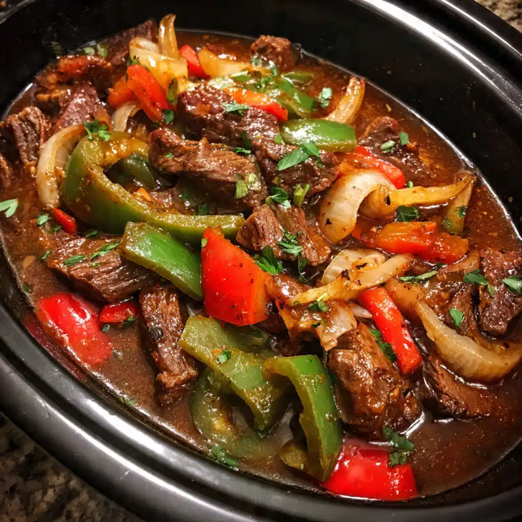 Crock Pot Pepper Steak is incredibly tender, loaded with flavor, and couldn't be easier to make