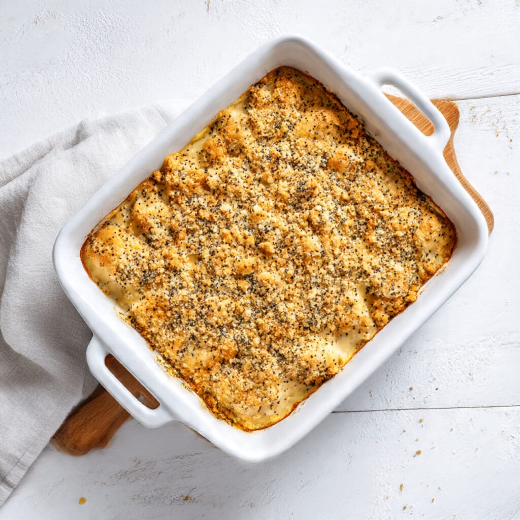 creamy poppy seed chicken casserole is the ultimate comfort food! With tender chicken, a rich sauce, and a buttery cracker topping
