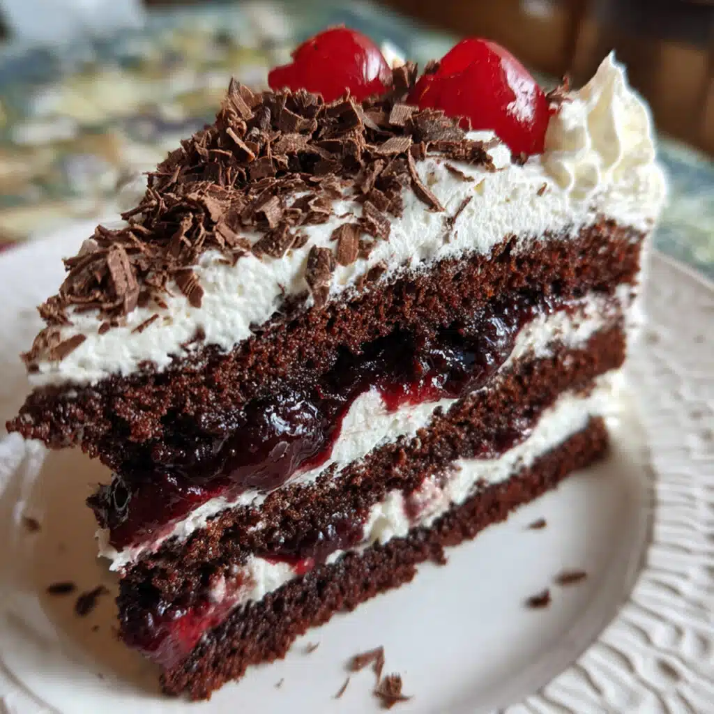 homemade Black Forest Cake is easier than you think! Moist chocolate layers, sweet cherry filling, and fluffy whipped cream make this German classic absolutely irresistible
