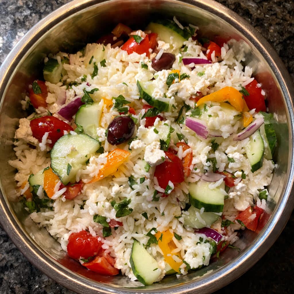 fresh and flavorful Greek Salad is ready in just 15 minutes with crisp vegetables, tangy feta, briny olives, and a simple homemade dressing that brings all those beautiful Mediterranean flavors