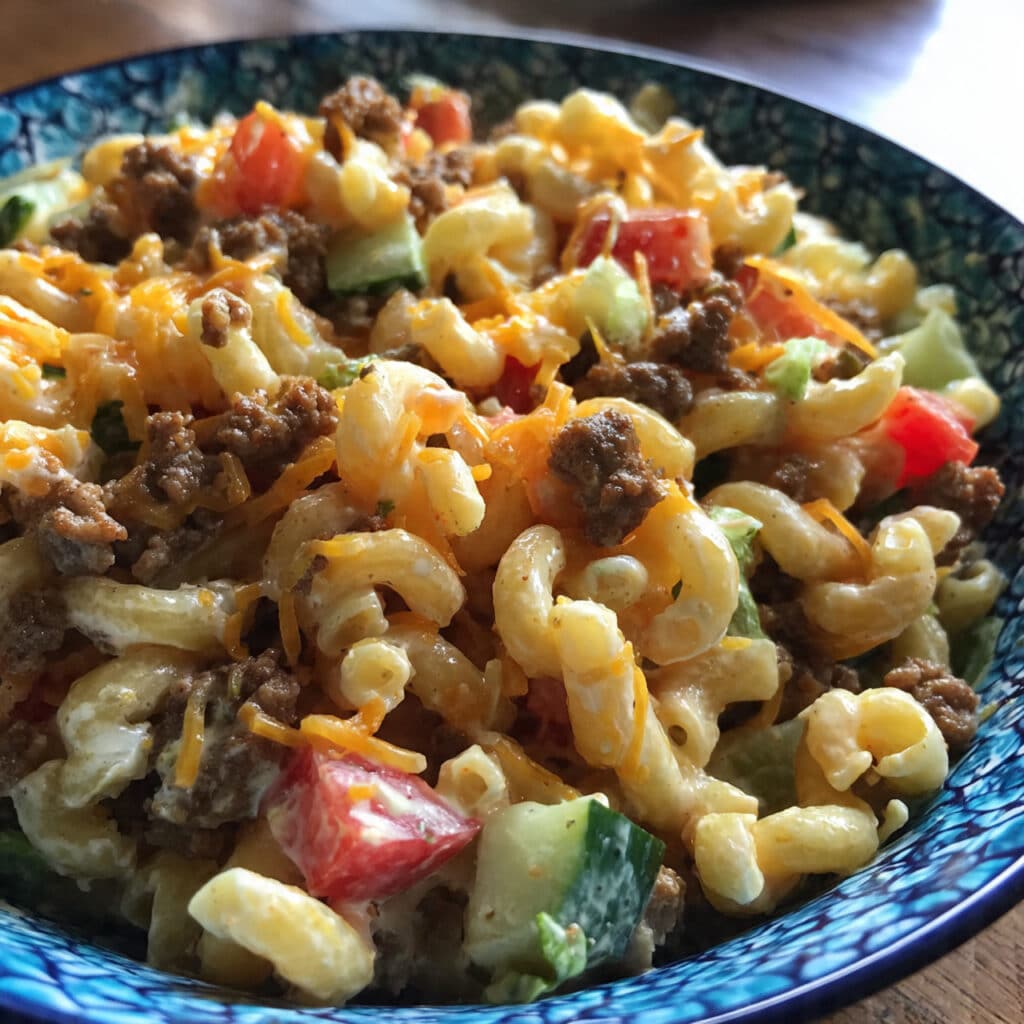 Big Mac Pasta Salad tastes exactly like your favorite burger—but you can eat it with a fork! Creamy, tangy, and loaded with all the classic flavors