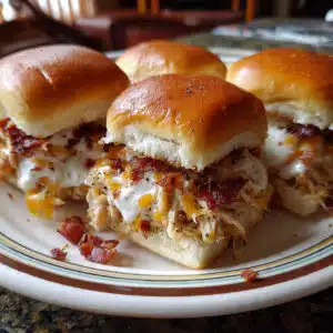 Chicken Bacon Ranch Sliders 11 Chicken Bacon Ranch Sliders are the easiest party food ever! Tender chicken, crispy bacon, ranch, and melted cheese on buttery Hawaiian rolls.